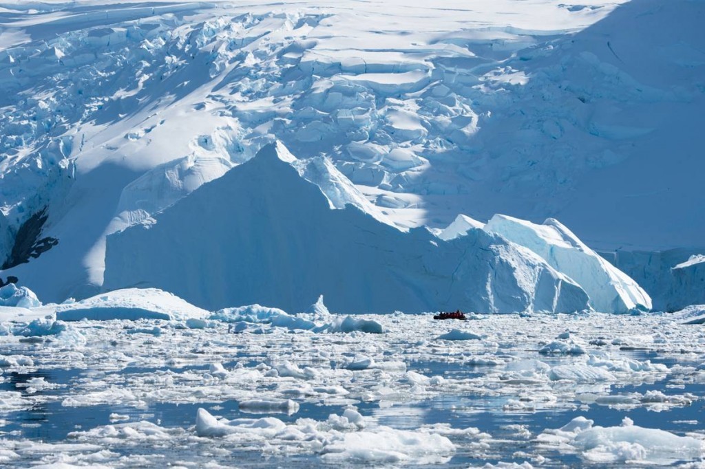 Zodiac cruising in Cierva Cove surrounded by massive ice walls